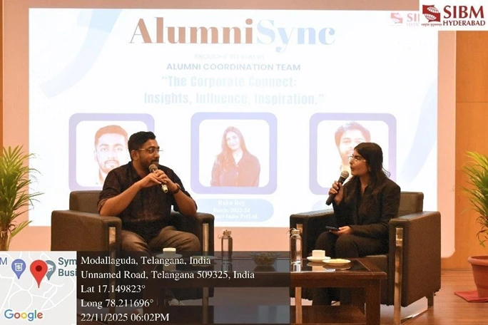 The alumni and moderator share an engaging discussion